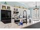 Modern kitchen with stainless appliances, quartz countertops, and stylish backsplash at 116 Cypress Estates Dr., Murrells Inlet, SC 29576