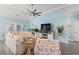 Comfortable living room featuring a large TV, stylish furniture, and bright, airy atmosphere at 116 Cypress Estates Dr., Murrells Inlet, SC 29576