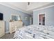 Serene main bedroom featuring tray ceilings, calming colors, and a large dresser at 116 Cypress Estates Dr., Murrells Inlet, SC 29576