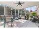 Enclosed screened porch with seating and a view of the outdoors, perfect for relaxing or entertaining at 116 Cypress Estates Dr., Murrells Inlet, SC 29576