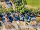 High-definition aerial view capturing the layout of houses and the community's proximity to green spaces and recreation fields at 116 Great Lakes Rd., Pawleys Island, SC 29585