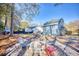 Cozy backyard with a gravel firepit and seating area, perfect for entertaining guests and enjoying outdoor relaxation at 116 Great Lakes Rd., Pawleys Island, SC 29585