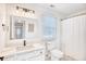 Bright bathroom with a white vanity, modern fixtures, and a framed mirror at 116 Great Lakes Rd., Pawleys Island, SC 29585