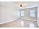 Bedroom with a ceiling fan, neutral paint, and wood-look flooring at 116 Great Lakes Rd., Pawleys Island, SC 29585