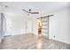 Bright bedroom featuring modern ceiling fan, and a bathroom with sliding barn door entry at 116 Great Lakes Rd., Pawleys Island, SC 29585