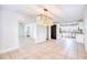 Open floor plan featuring a dining room with a stylish chandelier adjacent to the kitchen at 116 Great Lakes Rd., Pawleys Island, SC 29585