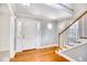 Inviting foyer featuring hardwood floors, natural light, and staircase access at 116 Great Lakes Rd., Pawleys Island, SC 29585