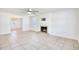 Spacious living room with tile flooring, a fireplace, and ample natural light at 116 Great Lakes Rd., Pawleys Island, SC 29585