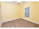 Cozy bedroom features neutral carpet and a sunny window at 118 Birch N Coppice Dr. # 3, Surfside Beach, SC 29575