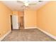 Spacious bedroom with neutral carpet, a ceiling fan and a doorway to the bathroom at 118 Birch N Coppice Dr. # 3, Surfside Beach, SC 29575