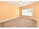 Cozy bedroom with large window, plush carpeting, and neutral color palette at 118 Birch N Coppice Dr. # 3, Surfside Beach, SC 29575