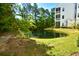 Scenic view of a pond surrounded by lush landscaping at 118 Birch N Coppice Dr. # 3, Surfside Beach, SC 29575