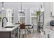 Open dining area featuring natural light and a modern chandelier at 1196 Fiddlehead Way, Myrtle Beach, SC 29579