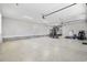 Spacious garage with epoxy flooring features a home gym and plenty of room for vehicles and storage at 1196 Fiddlehead Way, Myrtle Beach, SC 29579