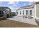 Inviting backyard patio with comfortable rocking chairs and a built-in grill, perfect for outdoor entertaining at 1196 Fiddlehead Way, Myrtle Beach, SC 29579