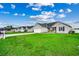 View of a well-manicured lawn with a single-story home with a grey exterior at 124 Blue Jacket Dr., Galivants Ferry, SC 29544