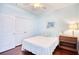 This bedroom features a double closet, a ceiling fan, and plenty of natural light at 128 Belclare Way, Longs, SC 29568