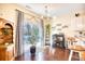 Dining area with a sliding glass door to the backyard patio and a stylish chandelier at 128 Belclare Way, Longs, SC 29568