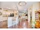 Open concept kitchen view with breakfast bar, leading into other living areas with hardwood flooring at 128 Belclare Way, Longs, SC 29568