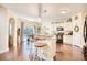 Spacious kitchen with granite countertops, an island with barstool seating, and stainless steel appliances at 128 Belclare Way, Longs, SC 29568