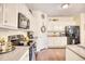 Bright kitchen with stainless steel appliances, granite countertops, and ample cabinet storage at 128 Belclare Way, Longs, SC 29568