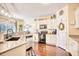 Well-lit kitchen with granite countertops, stainless steel appliances, and abundant cabinet space at 128 Belclare Way, Longs, SC 29568