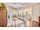 Inviting living room with hardwood floors, an open layout, and access to the dining area and kitchen at 128 Belclare Way, Longs, SC 29568