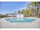 Community pool with lounge chairs, landscaping, and a clear blue sky at 128 Belclare Way, Longs, SC 29568