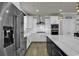 Modern kitchen featuring stainless steel appliances and white cabinets at 130 Black Water Dr., Murrells Inlet, SC 29576