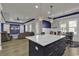 Island kitchen open to living area with white cabinets at 130 Black Water Dr., Murrells Inlet, SC 29576