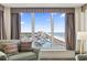 Inviting living room features large window with beach views, comfortable seating, and stylish decor at 1321 S Ocean Blvd. # 1101, North Myrtle Beach, SC 29582