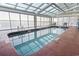 Bright indoor pool area bathed in natural light, complete with lounge chairs for relaxation at 1321 S Ocean Blvd. # 1101, North Myrtle Beach, SC 29582