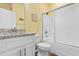 Yellow walled bathroom with a granite vanity and a white shower and tub combo at 136 Birch N Coppice Dr. # 11, Surfside Beach, SC 29575