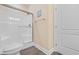 Well-lit bathroom featuring a white shower, toilet, and wood-look floors at 136 Birch N Coppice Dr. # 11, Surfside Beach, SC 29575