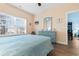 Bright bedroom with a dresser and large window at 136 Birch N Coppice Dr. # 11, Surfside Beach, SC 29575