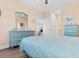 Bright bedroom with light blue furnishings, wood-look floors, and coastal décor at 136 Birch N Coppice Dr. # 11, Surfside Beach, SC 29575