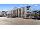 Well-maintained condo complex with brick and column facade and on-site parking at 136 Birch N Coppice Dr. # 11, Surfside Beach, SC 29575