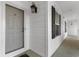 Unit 11 has a well-lit, secure entrance with a screen door and classic lantern fixture at 136 Birch N Coppice Dr. # 11, Surfside Beach, SC 29575