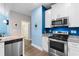 Bright kitchen with granite counters, stainless steel appliances and an adjoining dining area at 136 Birch N Coppice Dr. # 11, Surfside Beach, SC 29575