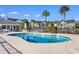 Community pool with lounge seating and grilling station at 136 Birch N Coppice Dr. # 11, Surfside Beach, SC 29575