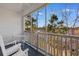A screened in porch with white furniture and a view of the surrounding neighborhood at 136 Birch N Coppice Dr. # 11, Surfside Beach, SC 29575