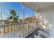 Relaxing screened porch with rocking chairs and outdoor seating at 136 Birch N Coppice Dr. # 11, Surfside Beach, SC 29575