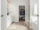 Bathroom showcasing dual vanity sinks, a walk-in shower, and a walk-in closet at 1377 Tessera Way, Myrtle Beach, SC 29579