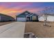 Charming single-story home with blue siding, a well-manicured lawn, and a two-car garage at 1377 Tessera Way, Myrtle Beach, SC 29579