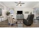 Inviting living room with a ceiling fan, a variety of seating, and stylish decor throughout the space at 1377 Tessera Way, Myrtle Beach, SC 29579