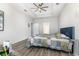 A view of a main bedroom with a decorative bedspread and a ceiling fan at 1377 Tessera Way, Myrtle Beach, SC 29579