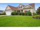 Charming two-story home with red shutters and a well-manicured green lawn at 1425 Tiger Grand Dr., Conway, SC 29526