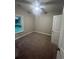 Spacious bedroom with carpet flooring and a window at 150 Honeydew Rd., Myrtle Beach, SC 29588