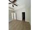 Bright bedroom featuring wood floors and multiple doors at 150 Honeydew Rd., Myrtle Beach, SC 29588