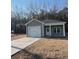 Single-story home with a two-car garage and front yard at 150 Honeydew Rd., Myrtle Beach, SC 29588